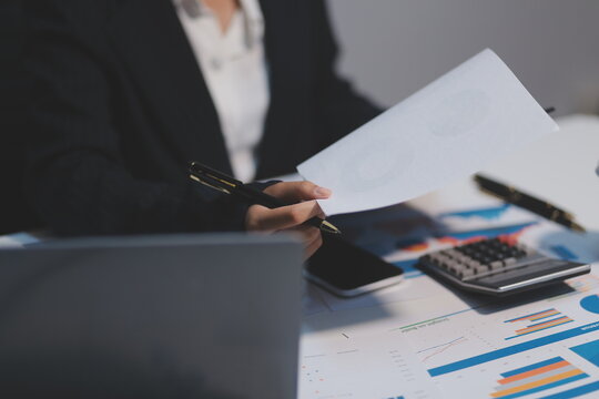 Audit concept,Administrator business man financial inspector and secretary making report calculating balance. Internal Revenue Service checking document.