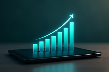 Glowing bar graph showing growth on tablet