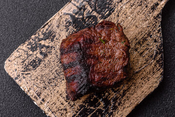 Grilled beef steak meat with salt and pepper. Beef steak grilled on a barbecue
