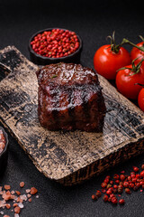 Grilled beef steak meat with salt and pepper. Beef steak grilled on a barbecue
