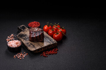 Grilled beef steak meat with salt and pepper. Beef steak grilled on a barbecue