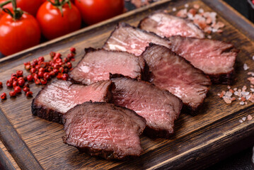 Grilled beef steak meat with salt and pepper. Beef steak grilled on a barbecue