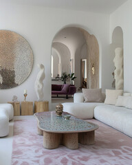 Luxurious and minimalist living room with neutral tones, curved sofa, organic coffee table and architectural arches. Elegant design.