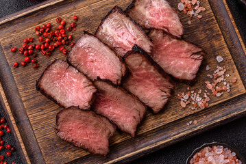 Grilled beef steak meat with salt and pepper. Beef steak grilled on a barbecue