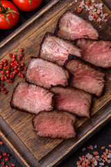 Grilled beef steak meat with salt and pepper. Beef steak grilled on a barbecue