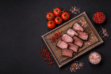 Grilled beef steak meat with salt and pepper. Beef steak grilled on a barbecue
