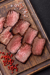 Grilled beef steak meat with salt and pepper. Beef steak grilled on a barbecue