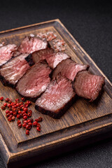 Grilled beef steak meat with salt and pepper. Beef steak grilled on a barbecue