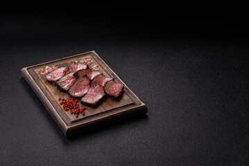 Grilled beef steak meat with salt and pepper. Beef steak grilled on a barbecue