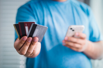 Online shopping experience paying with credit cards home office digital payment casual setting...