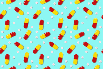A seamless background with pills and capsules. A bright colorful medical background. Red, yellow and blue medicine background.