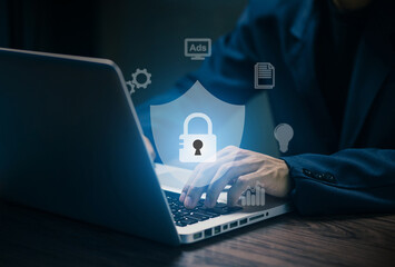 Cybersecurity concept with businessman typing on laptop, protected by digital lock icon. Data protection, privacy, and secure internet communication technology.