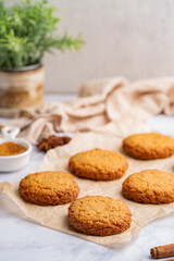 Homemade peanut or almond butter cookies or oatmeal cookies on white kitchen background. High quality photo