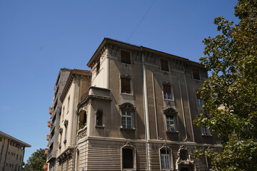 Facade of old building with windows.