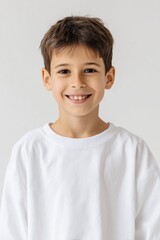 Portrait of a Smiling Young Boy in White Shirt