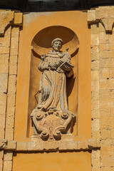 Statue of Saint Anthony of Padua on the facade of the Church of Santa Rosalia in Cagliari. Sardinia, Italy