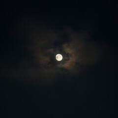 clouds sorrounding the moon night