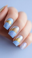 Aquatic elegance with a touch of gold: Hands with nails decorated in a design reminiscent of blue and white waves, accentuated by a shiny gold stripe. Ideal for beauty themes, sophisticated nail art a