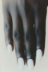 Minimalist elegance: Close-up of a hand with perfectly manicured nails in classic white. Ideal for beauty, manicure, self-care and sophistication themes.