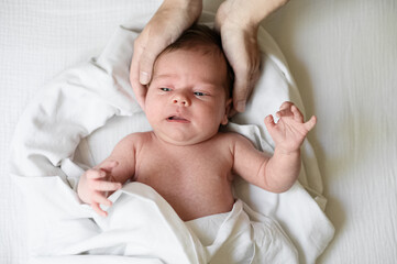 Tender Moment Between Mother and Newborn Baby