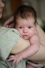 Tender Moment Between Mother and Newborn Baby