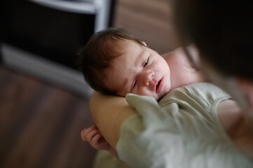 Tender Moment Between Mother and Newborn Baby