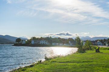 Sun shining over Kyleakin village, Isle of Skye, Scottish Highlands, at summer.