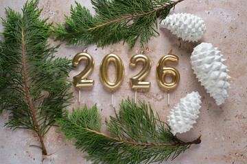 Festive New Year 2026 Celebration With Candles and Pine Cones