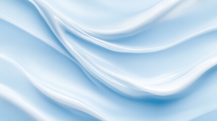 Abstract smooth blue silk texture creating elegant soft wave patterns.