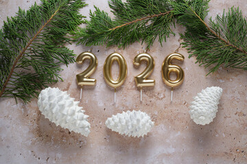 Festive New Year 2026 Celebration With Candles and Pine Cones