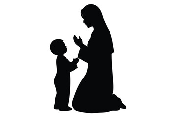 Silhouette of mother praying with child in arms