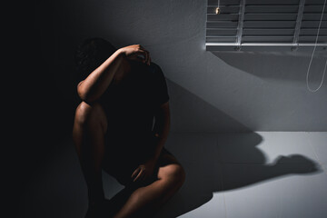 Man pain and despair facing depression alone a dim room emotional health struggles silent isolation