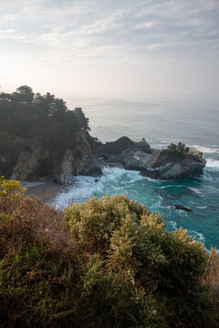 Atmospheric View of McWay Falls on a Moody, Foggy Day Along the Rugged Big Sur Coast in California