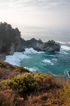 Atmospheric View of McWay Falls on a Moody, Foggy Day Along the Rugged Big Sur Coast in California