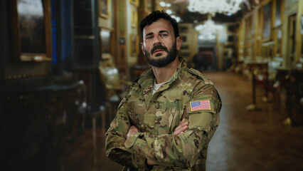 Hispanic man in military uniform with beard stands confidently in art gallery exhibiting cultural...