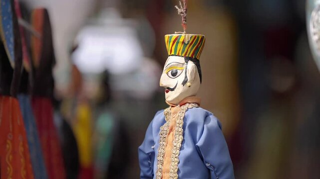 Traditional Kathputli puppets from Rajasthan, India, displayed together with a close-up of a male puppet, featuring vibrant colors, intricate details, and cultural artistry