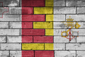 colourful painted big national flag of vatican city and flag of malta on a massive old brick wall background. concept