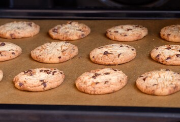 Close-up shot of cookies on a baking tray in the oven.
