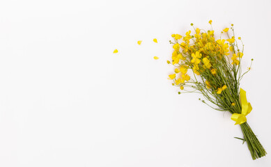 Midsummer bouquet with yellow wildflowers, buttercups and herbs, symbolic floral flat lay for...