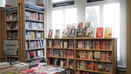 Defocused view of a library interior with rows of european history books on wooden shelves and blurred foreground displaying open textbooks and vibrant covers.