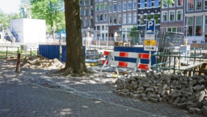 Blurred construction site with barricades, defocused urban background showcasing building...
