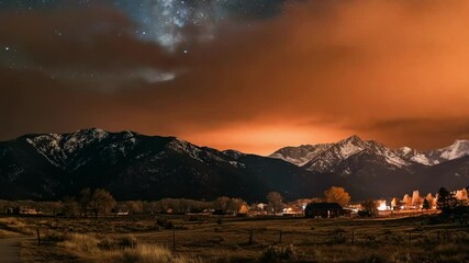 Nighttime mountain landscape with fiery sky - Powered by Adobe