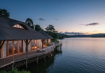 Fototapeta premium Luxury safari lodge overlooking the vast Serengeti landscape during golden hour. Scenic view of wildlife plains, acacia trees, and open skies in Tanzania.