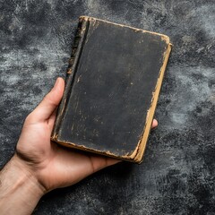 Hand Holding Old Worn Black Book,Vintage Book, Antique Book