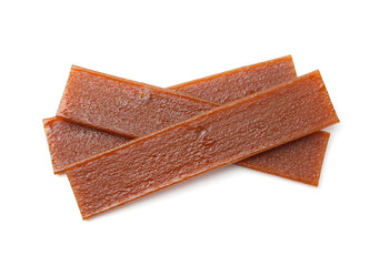 Pieces of delicious fruit leather on white background, top view