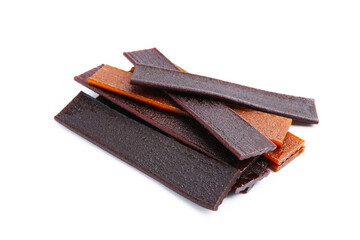 Pieces of delicious fruit leather on white background