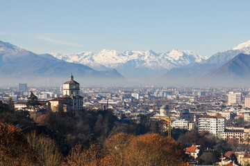 Cityscape of Turin (Torino) with snowy Alps mountains on background. Piedmont, Italy