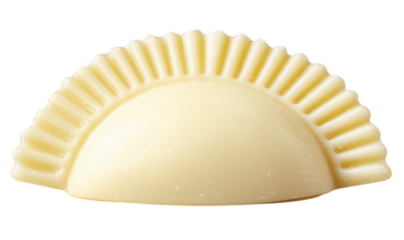 A single uncooked ravioli with a crimped edge, featuring a smooth, pale dough exterior.