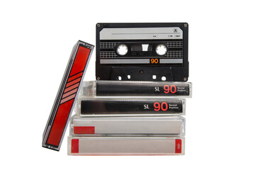 Stack of vintage audio cassette tapes with one black tape standing upright on top, all labeled "90", isolated on white back
