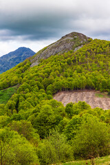 Panorama of the Cantal mountains around the Jordanne Valley from a hiking trail through the forest of Mandailles-Saint-Julien